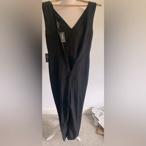 Express Faltering black V neck in front and back jumpsuit Size XS